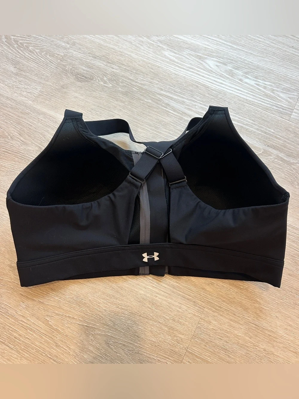 Under Armour black sports bra with zipper in size 38DD